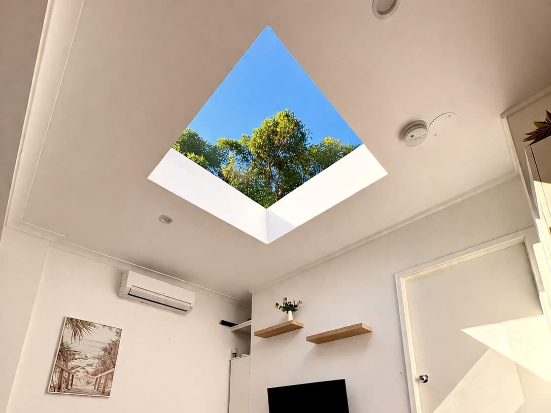 Same room after skylight install. Daylight pouring in from above.