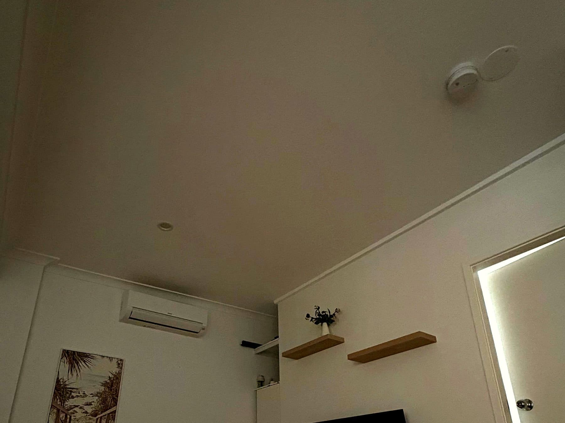 Room before skylight install. Plain ceiling, low natural light.